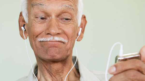 Senior Listening to Music on Mobile Device