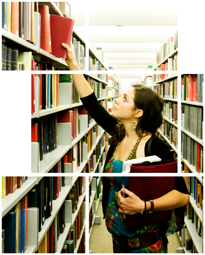 Student reaching for a book from the shelf