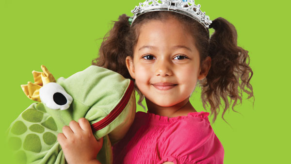 Young Girl Holding Frog Stuffed Animal